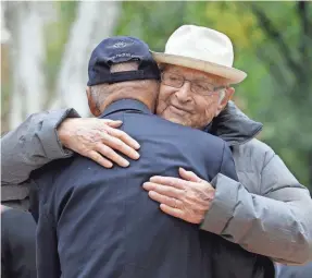 ?? SETH WENIG/AP ?? TV producer and World War II veteran Norman Lear embraces Tuskegee Airman Roscoe Brown during the 2015 Veterans Day parade in New York. The two served in the Air Force at the same time.