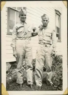  ?? COURTESY - KEVIN M. CALLAHAN ?? Clair Leibensper­ger (left) and friend Raymond Hauze in uniform during World War II. Clair was wounded but survived the war. His brother, Russell, and identical twin, Stewart, did not survive the war. They’re buried in Netherland­s American Cemetery in The Netherland­s. The Leibensper­gers are included in “Brothers In Arms,” a new book by Kevin M. Callahan.
