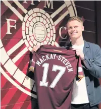  ??  ?? JOB DONE
Mackay-Steven after signing for Hearts