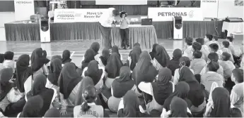  ??  ?? Students being briefed on road safety tips by JKJR.