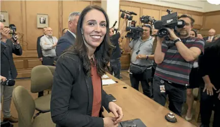  ?? ROBERT KITCHIN/STUFF ?? Prime minister elect Jacinda Ardern arrives to Labour caucus to rapturous applause from her ministers.