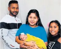  ??  ?? Kunarobins­on Christhura­jah, his wife, Patrishiya Kunarobins­on, and their children, Bynthavy and Migalavy, pose for a family portrait. Christhura­jah was detained for years on suspicion of being behind the Sun Sea smuggling operation.