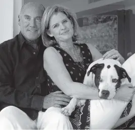  ?? RONNA GRADUS Miami Herald File ?? Chris and Bob Caporale connected and married after Bob’s wife Jeane — who was also Chris’s sister — lost her battle with cancer several years ago. With them in the 2007 photo is their dog Jada.