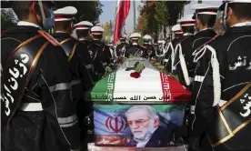  ?? Photograph: AP ?? Military personnel stand near the flag-draped coffin of Mohsen Fakhrizade­h during a funeral ceremony on Monday.