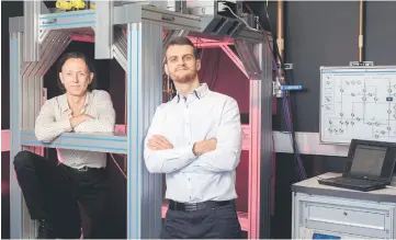  ??  ?? Quantum computatio­n engineers AMorello (left) and Tosi from the University of New South Wales are photograph­ed in this handout imaged in Sydney, Australia, July 24. In the experiment­s described in the paper, IBM researcher­s used a quantum computer to...