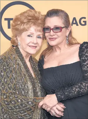  ??  ?? TWO OF A KIND: Carrie Fisher with her mother Debbie Reynolds at the Screen Actors Guild Awards last year.