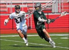  ?? AUSTIN HERTZOG — DIGITAL FIRST MEDIA ?? Spring-Ford’s Tanner Romano uses his stick to affect the shot of Bishop Shanahan’s Sam Goforth during the District 1fifth place game Thursday at Owen J. Roberts.