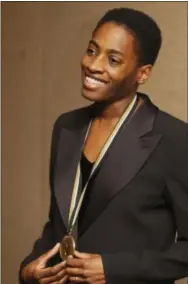  ?? MARK LENNIHAN — THE ASSOCIATED PRESS FILE ?? In this file photo, Jacqueline Woodson, a nominee for the National Book Award for young people’s literature, poses for photograph­ers before the ceremony in New York. Woodson has been named the country’s new National Ambassador for Young People’s...