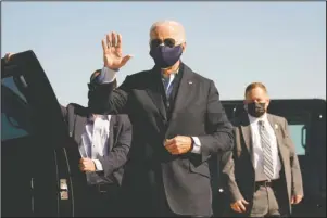  ?? The Associated Press ?? BIDEN: Democratic presidenti­al candidate former Vice President Joe Biden arrives to board his campaign plane at the New Castle Airport in New Castle, Del., Sunday, en route to Durham, N.C.