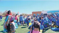  ?? COURTESY PHOTO ?? Miss Indian New Mexico Janessa Bowekaty helps celebrate a new playground in Zuni, courtesy of Blue Cross Blue Shield of New Mexico.