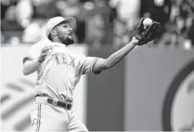  ?? Mike Stobe/getty Images ?? Marcus Semien’s defense hasn’t been a concern for the Rangers, but at the plate, he is batting a team-low .165 and has not hit a home run this season.