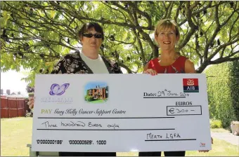  ??  ?? Meath LGFA Treasurer Patricia Mead presents Ann Tracey of the Gary Kelly Cancer Support Centre with a cheque for€300 which were part proceeds of the recent Meath Ladies All Star Charity game.