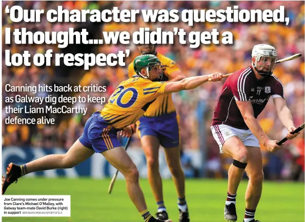  ?? BRENDAN MORAN/SPORTSFILE ?? Joe Canning comes under pressure from Clare’s Michael O’Malley, with Galway team-mate David Burke (right) in support