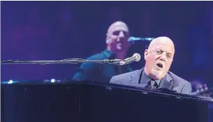  ?? MICHAEL ZORN THE ASSOCIATED PRESS FILE PHOTO ?? There is something enjoyable about the over-the-top absurdity of Billy Joel’s “We Didn’t Start the Fire,” writes Lindsay Zoldaz, who was blown away by the song as a young child.