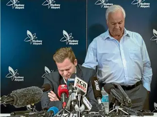  ?? BROOK MITCHELL/GETTY IMAGES ?? An emotional Steve Smith is comforted by his father Peter as he fronts the media at Sydney Airport.