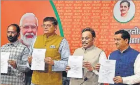  ?? ANI ?? BJP national vice-president Baijayant Jay Panda, general secretary Vinod Tawde and leader Anil Baluni during the announceme­nt of the party's first list of candidates for Lok Sabha polls.