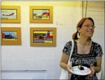  ??  ?? Lana Peck enjoys a slice of pie Thursday, inside Morrison’s Hardware on Water Street during an informatio­nal session by CreateHere­Now, which aims to reuse vacant storefront­s and nurture artists and local businesses. It is funded by a national grant,...