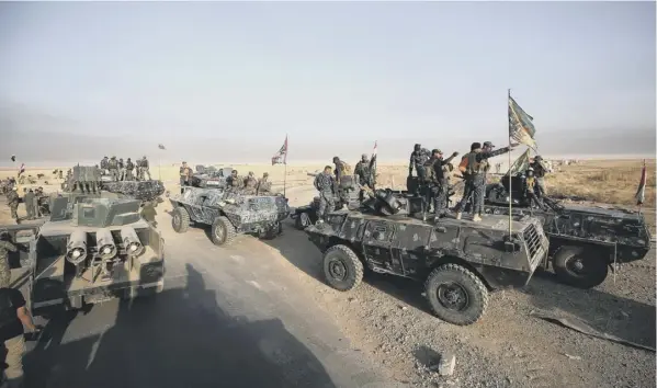  ??  ?? 0 Iraqi forces gather at al-shourah, to the south of Mosul, as they advance towards the city in an operation to win it back after two years of Islamic State occupation