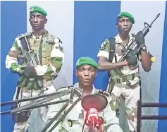  ??  ?? This video grab made on a video footage obtained on YouTube shows Gabon soldiers on state radio calling on the people to ‘rise up’ and announcing a ‘national restoratio­n council’ would be formed. — AFP photo