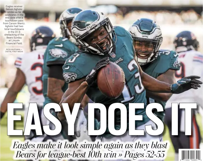  ?? RICK KAUFFMAN — DIGITAL FIRST MEDIA ?? Eagles receiver Nelson Agholor smiles as he celebrates in the end zone after a touchdown pass from Carson Wentz. Agholor had two total touchdowns in the 31-3 shellackin­g of the Bears Sunday at Lincoln Financial Field.