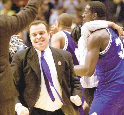  ?? JACK SMITH/AP ?? Hampton coach Steve Merfeld and his players celebrate after the No. 15 seed Pirates knocked off No. 2 seed Iowa State 58-57 in a first-round NCAA Tournament game on March 15, 2001, in Boise, Idaho.
