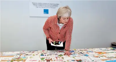  ?? ?? Maidenhead MP Theresa May at the judging of last year's Christmas card competitio­n. Ref:134022-9