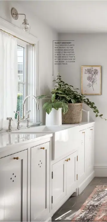  ??  ?? INJECT GREENERY TALL INDOOR PLANTS ADD HEIGHT TO THE SHORTER BENCHTOP, VISUALLY BALANCING IT WITH THE SLIGHTLY TALLER BENCH THAT’S AT THE OTHER SIDE OF THE ROOM - A CLEVER DESIGN TRICK.