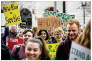  ?? AL DRAGO / NYT ?? Protesters rally against President Donald Trump’s revised travel ban at the Customs and Border Protection headquarte­rs in Washington on March 7. A federal judge in Hawaii froze the order on Wednesday.