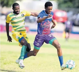  ?? GLADSTONE TAYLOR ?? Shakeon Satchwell (right) of Portmore United dribbles away from Kemmoy Phillips of Vere United during a Jamaica Premier League match at Ashenheim Stadium, Jamaica College on Sunday, February 26, 2023. Portmore won 2-0.