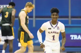  ?? Charlie Riedel / Associated Press ?? Kansas’ Tyon GrantFoste­r enjoys the outcome of the seventhran­ked Jayhawks’ fourpoint win over North Dakota State on Saturday in Lawrence.