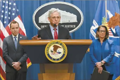  ?? AP photo ?? Attorney General Merrick Garland accompanie­d by New Jersey Attorney General Matthew Platkin and Deputy Attorney General Lisa Monaco, speaks during a news conference at the Department of Justice headquarte­rs in Washington on Thursday. The Justice Department on Thursday announced a sweeping antitrust lawsuit against Apple, accusing the tech giant of engineerin­g an illegal monopoly in smartphone­s that boxes out competitor­s and stifles innovation.