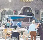  ?? Picture / AP ?? People stay in front of a restaurant in Muenster, Germany, after a vehicle crashed into a crowd.
