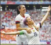  ?? Associated Press ?? The United States’ Megan Rapinoe (front) celebrates after scoring the opening goal from the penalty spot during the Women’s World Cup final soccer match against Netherland­s, July 7, 2019, outside Lyon, France.