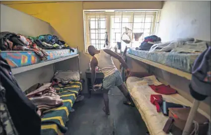  ??  ?? Crammed: Jo’burg must legally provide shelter to evictees, but temporary facilities (above) are full. The mayor says he plans to revitalise the inner city and build more affordable housing (below). Photos: Delwyn Verasamy