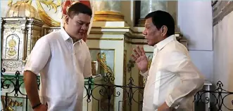  ??  ?? President Rodrigo Duterte talks to his son, Paolo Duterte, at San Agustin Church in Intramuros, Manila in this file government photo. (King Rodriguez)