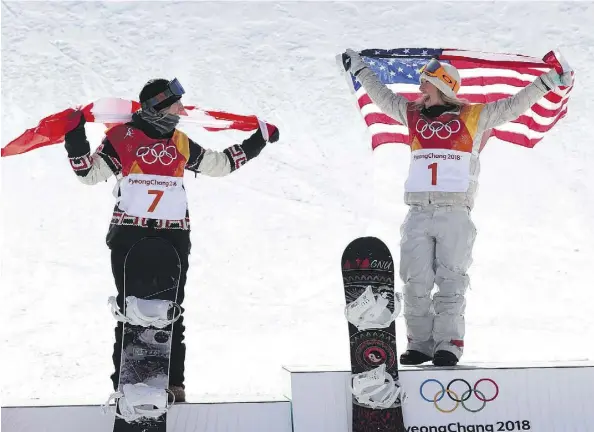  ?? JEAN LEVAC ?? Silver medallist Laurie Blouin of Canada, left, and gold medallist Jamie Anderson of the U.S. are happy to be on the podium after the women’s slopestyle event at the Phoenix Snow Park on Monday. Unpredicta­ble, strong winds made the final a war of...