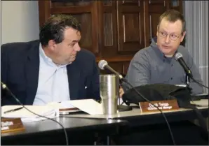  ??  ?? AT ODDS: Hot Springs Village Property Owners’ Associatio­n Board Member Jeff Atkins, right, expresses his disagreeme­nt with board practices while COO and General Manager David Twiggs looks on during the November meeting, held Wednesday in the Ponce de...