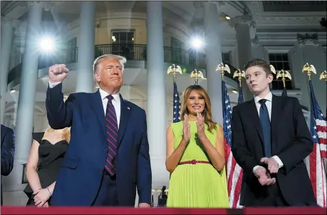  ?? THE ASSOCIATED PRESS ?? President Donald Trump, first lady Melania Trump and Barron Trump stand on the South Lawn of the White House on the fourth day of the Republican National Convention Aug. 27in Washington. It’s called a “permission structure.” President Donald Trump’s campaign is trying to construct an emotional and psychologi­cal gateway to help disenchant­ed voters feel comfortabl­e voting for the president again despite their reservatio­ns about him personally.