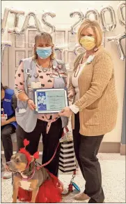  ?? Hamilton health Care system ?? Shaonia, a 9-year-old American Kennel Club registered American Staffordsh­ire terrier, recently celebrated her 2,000th pet visit with Hamilton Medical Center. With her, from left, are Joanne Davis, Shaonia’s owner, and Gay Ann Talley, Guest and Volunteer Services supervisor.