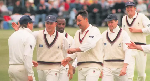  ??  ?? ALL SMILES: Minor Counties players celebrate taking a South Africa wicket during their meeting at Stone in the 1998 season.