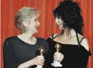  ?? Reed Saxon / Associated Press 1988 ?? Olympia Dukakis and Cher won Golden Globes for “Moonstruck.”