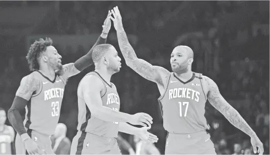  ?? GARY A. VASQUEZ/USA TODAY SPORTS ?? P.J. Tucker (17), Eric Gordon (10) and newly acquired Robert Covington (33) help mix things up for the Rockets.