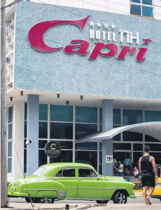  ?? Pictures / AP ?? One of the incidents happened on an upper floor of the recently renovated Hotel Capri, a 60- year- old concrete tower steps from the Malecon, Havana’s iconic, waterside promenade.