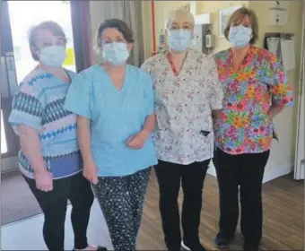  ??  ?? Some of the Gortonvogi­e Care Home staff in their new scrubs.