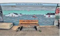  ?? ?? A mural on the seawall depicts the flood of 1953