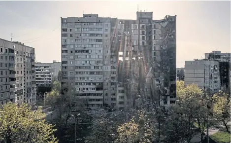  ?? ?? A building heavily damaged by multiple Russian bombardmen­ts stands near a frontline in Kharkiv, Ukraine.