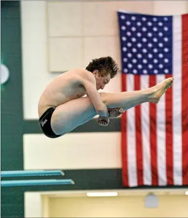  ?? PHOTO BY ALLAN BARGER - EXTREME TEAM SPORTS PHOTOS ?? FILE - Shenendeho­wa senior diver Nick Lydon perfoms a tucked dive at the Shenendeho­wa Aquatics Center pool during the 2016-17 season.