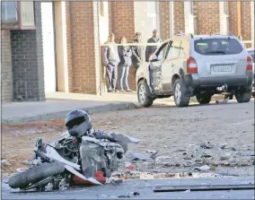  ??  ?? WRECKAGE: A 23-year-old biker, Ruan du Toit (above left), was killed when he collided with an SUV on the corner of Long and Black streets in the Kimberley CBD early yesterday morning.