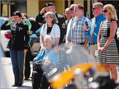  ?? PHOTOS BY SEAN D. ELLIOT/THE DAY ?? Above left, an honor guard of pallbearer­s from the Rhode Island Army National Guard carries the remains of U.S. Army Sgt. James Lawrence Campbell Tuesday into Byles Memorial Home in New London. Above, Campbell’s family including his sister, seated,...