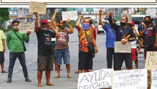  ?? BERNARD TESTA ?? AROUND 30 jeepney drivers from Caloocan City out of work since the lockdowns in March hold a rally to ask City Hall to let them ply their routes. They say they have yet to receive cash aid from the government, and that they should also be allowed to return as bus and taxi drivers were already earning a living. Transport advocates have asked the government to implement service contractin­g to protect transport workers and ensure adequate public transporta­tion in areas under the general community quarantine.